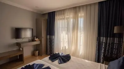 a hotel room with a bed with a bow on it at Farina Hotel By Cigno in Istanbul