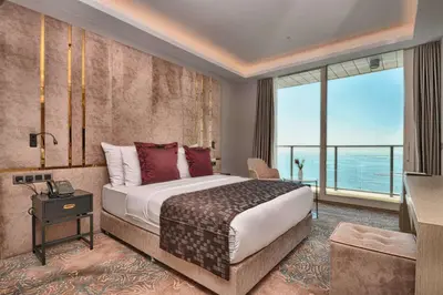 a hotel room with a bed and a large window at Best Western Premier Ottoperla Hotel in Istanbul