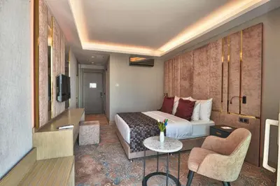 a hotel room with a bed and a tv at Best Western Premier Ottoperla Hotel in Istanbul