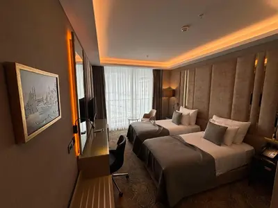 a hotel room with two beds and a television at Best Western Premier Ottoperla Hotel in Istanbul