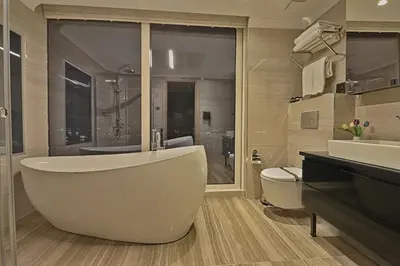 a bathroom with a tub and a sink and a toilet at Best Western Premier Ottoperla Hotel in Istanbul
