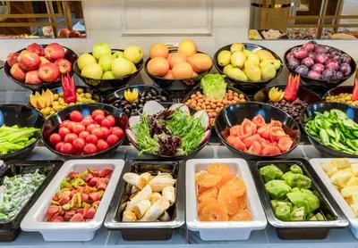 a buffet filled with bowls of different fruits and vegetables at Beethoven Senfoni Hotel in Istanbul