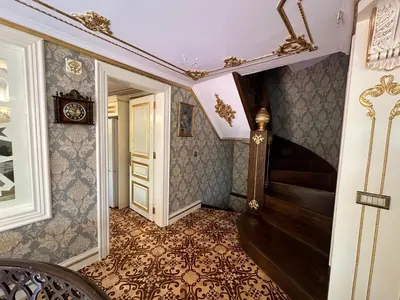 a hallway with a staircase and a stair case at TAHTAKALE KONAK HOTEL Private & Luxury in Bursa