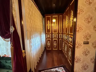 a hallway with wood paneling and a staircase in a house at TAHTAKALE KONAK HOTEL Private & Luxury in Bursa