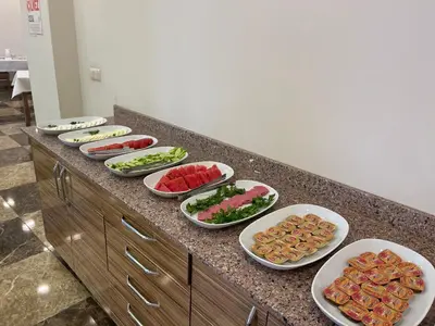 a buffet with many plates of food on a counter at Bursa Malkoc Hotel in Bursa