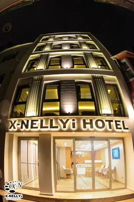 a hotel sign on the side of a building at X-NELLYİ HOTEL in Istanbul