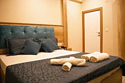 a bedroom with a bed with towels on it at Destinia Pera in Istanbul
