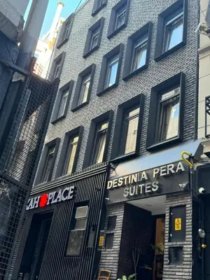 a building with a sign on the side of it at Destinia Pera in Istanbul