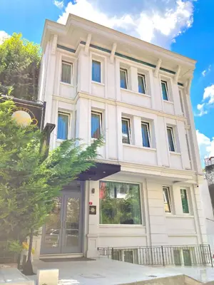 a large white building with a large door at Ligos in Istanbul
