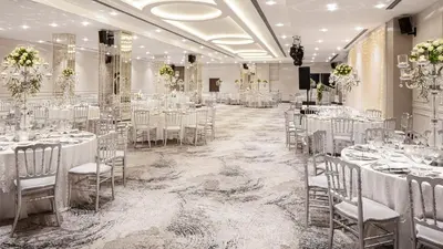a banquet hall with white tables and chairs at Delta Hotels by Marriott Istanbul Vadi in Istanbul