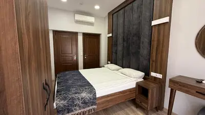 a bedroom with a bed and a wooden wall at Han Suite Hotel in Istanbul