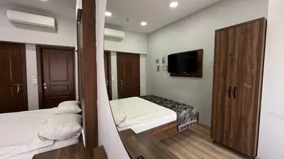 a bedroom with a bed and a flat screen tv at Han Suite Hotel in Istanbul