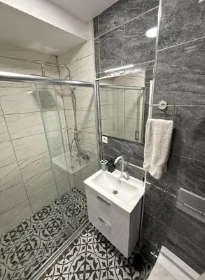 a bathroom with a sink and a shower at GV Suites Galata in Istanbul