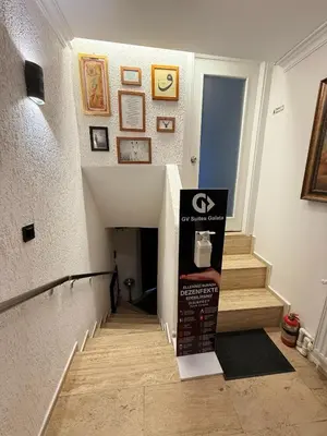 a room with a staircase with a box on the floor at GV Suites Galata in Istanbul