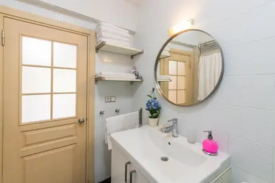 a bathroom with a sink and a mirror at Istanbul Amedros Home in Istanbul