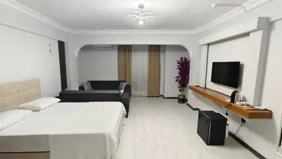 a hotel room with a bed and a television at KILIÇ MOTEL in Istanbul