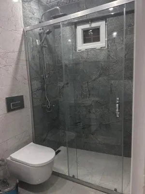 a bathroom with a shower and a toilet at KILIÇ MOTEL in Istanbul