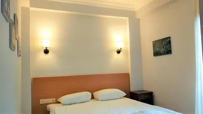 a bedroom with a bed with two pillows on it at Cheers Lighthouse in Istanbul