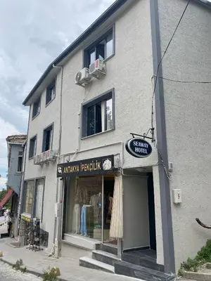 a building with a clothing store on a street at Seaway Hotel İstanbul in Istanbul