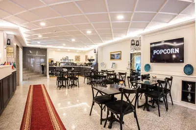 a restaurant with tables and chairs in a room at Royal Bosphorus Hotel & SPA Hamam in Istanbul