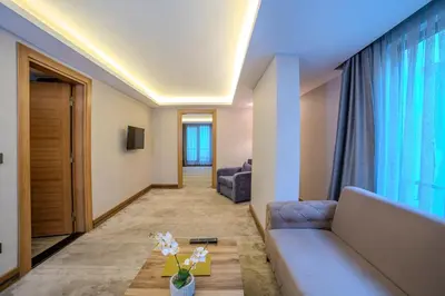 a living room with a couch and a table at Royal Termal Hotel in Bursa