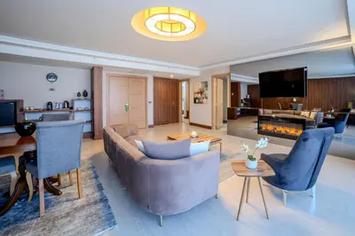 a living room with a couch and a fireplace at Royal Termal Hotel in Bursa