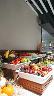 a buffet with many different fruits and vegetables on trays at Grand Sirkeci Hotel in Istanbul
