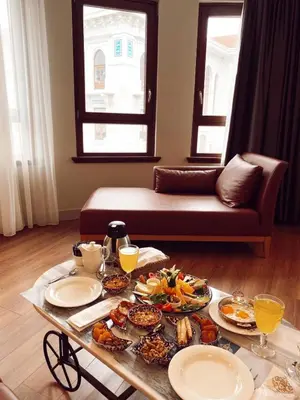 a table with plates of food on top of it at Grand Sirkeci Hotel in Istanbul