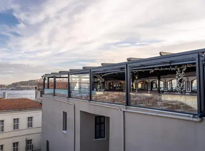 a building with a balcony with tables and chairs at Ferman Port Hotel - Special Category in Istanbul