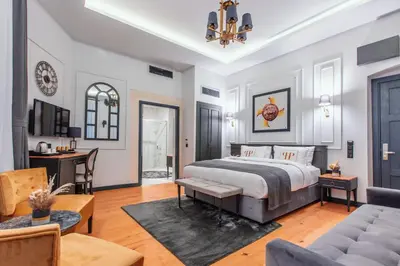 a bedroom with a bed and a living room at Ferman Port Hotel - Special Category in Istanbul