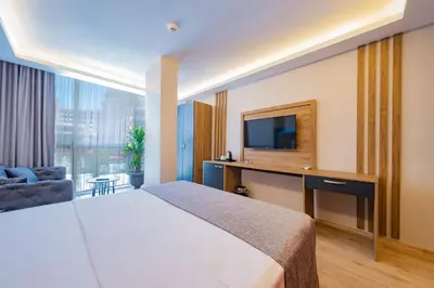 a hotel room with a bed and a television at RUSH HOTEL İSTANBUL in Istanbul