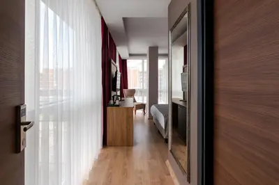 a hallway with a door leading to a room at RUSH HOTEL İSTANBUL in Istanbul