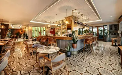 a restaurant with tables and chairs and a bar at 39 Kalamış Marina Hotel & Restaurant in Istanbul