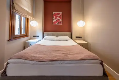 a bedroom with a large bed with two night stands at Bguest Pera Suites in Istanbul