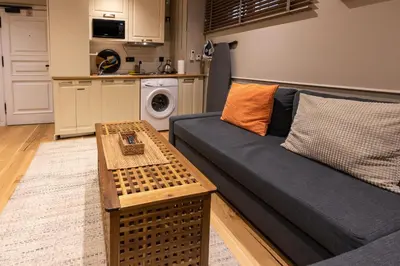 a living room with a couch and a table at Bguest Pera Suites in Istanbul