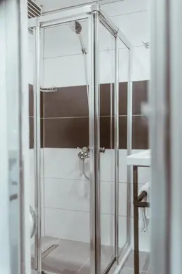 a shower with a glass door in a bathroom at PANDAN KARAKOY SUİT in Istanbul