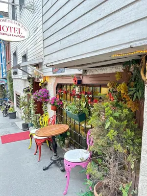 a table and chairs in front of a flower shop at Rose Bouquets Hotel in Istanbul