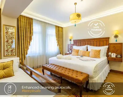 a hotel room with a large bed and a window at Best Point Suites Old City,Istanbul in Istanbul