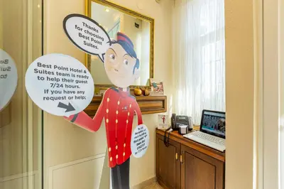 a statue of a woman holding a sign in a room at Best Point Suites Old City,Istanbul in Istanbul