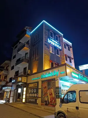 a building with a van parked in front of it at Hotel Ipekyolu in Sapanca