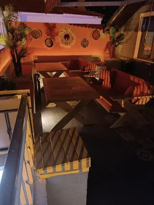 a room with couches and a table and chairs at Hotel Ipekyolu in Sapanca
