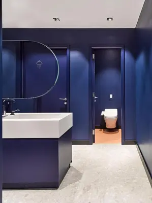 a blue bathroom with a sink and a toilet at Kepler Club Sabiha Gökçen Airport - International Transit Area in Istanbul