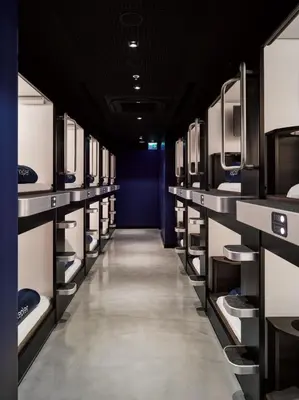 a long aisle of a room with white shelves at Kepler Club Sabiha Gökçen Airport - International Transit Area in Istanbul
