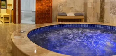 a large blue bath tub in a room at Ooda Rooms Kadıköy in Istanbul