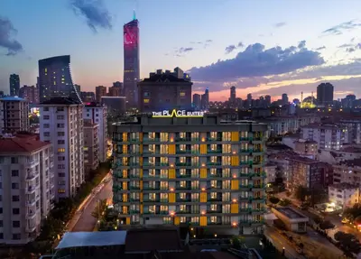 a city skyline at night with a tall building at Ataşehir The Place Suites in Istanbul
