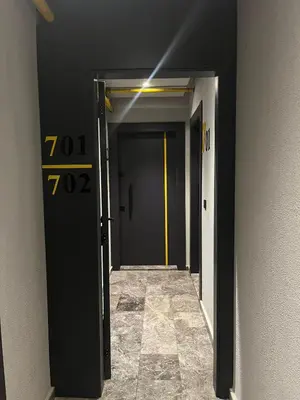 a hallway with two doors with numbers on them at Ataşehir The Place Suites in Istanbul