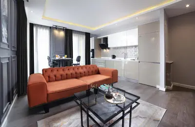 a living room with a couch and a table at Ataşehir The Place Suites in Istanbul