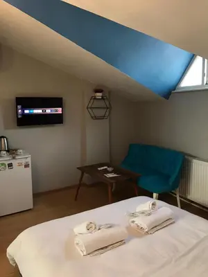 a bedroom with a bed and a blue ceiling at Zion Home Butik Otel in Istanbul