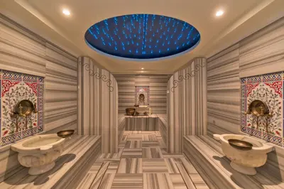 a bathroom with two sinks and a blue ceiling at Istanbul Dora Hotel in Istanbul