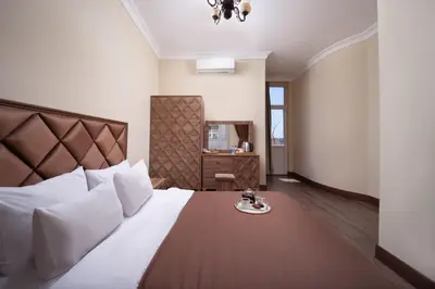 a bedroom with a large bed with a plate on it at taxim cool in Istanbul